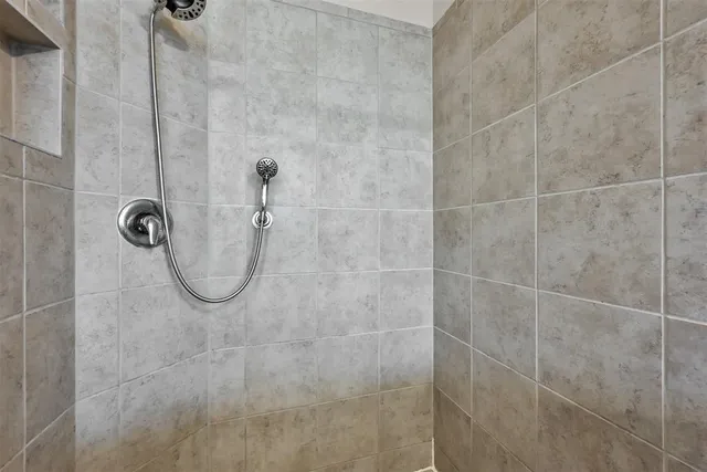 a view of a hallway with dining area and workspace