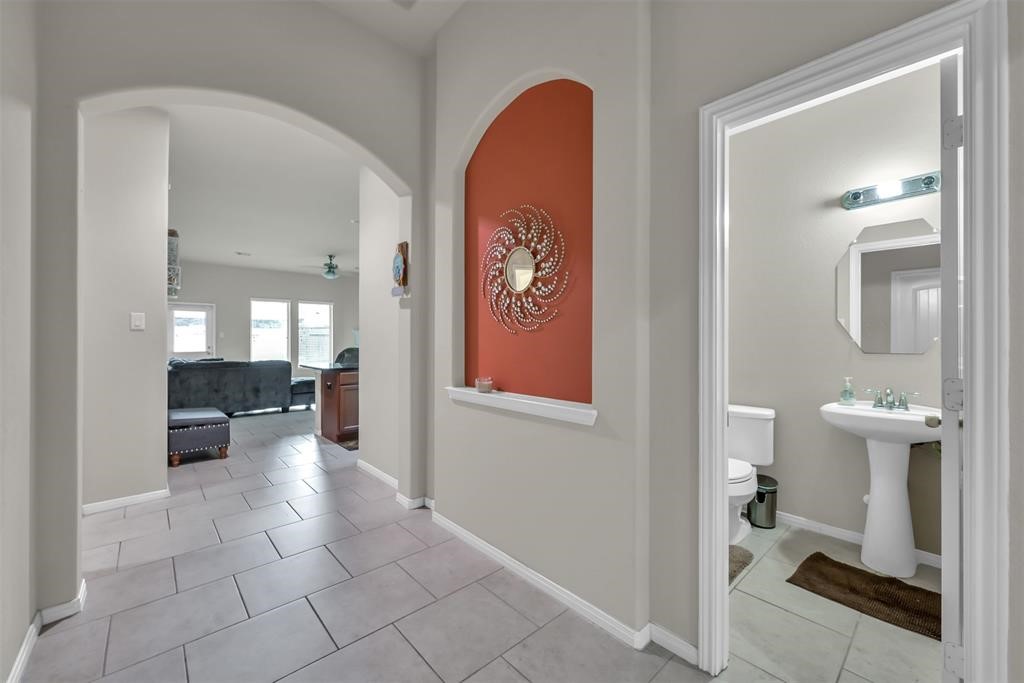 5415 Glenfield Spring Lane Spring, TX 77389 - Photo 16 of 16 a view of a hallway with dining area and workspace