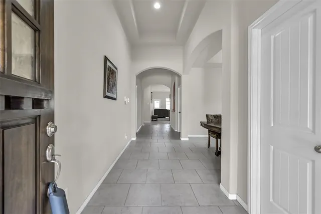 a view of a hallway view with staircase