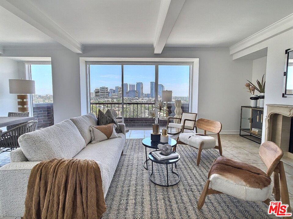 10550 Wilshire Boulevard, Unit 1004 Los Angeles, CA 90024 - Photo 13 of 39 a living room with furniture and a large window