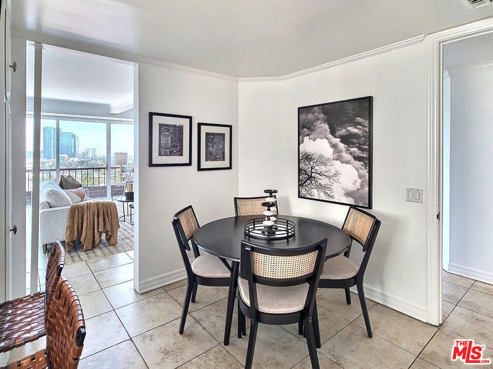 10550 Wilshire Boulevard, Unit 1004 Los Angeles, CA 90024 - Photo 17 of 39 a dining room with furniture and window