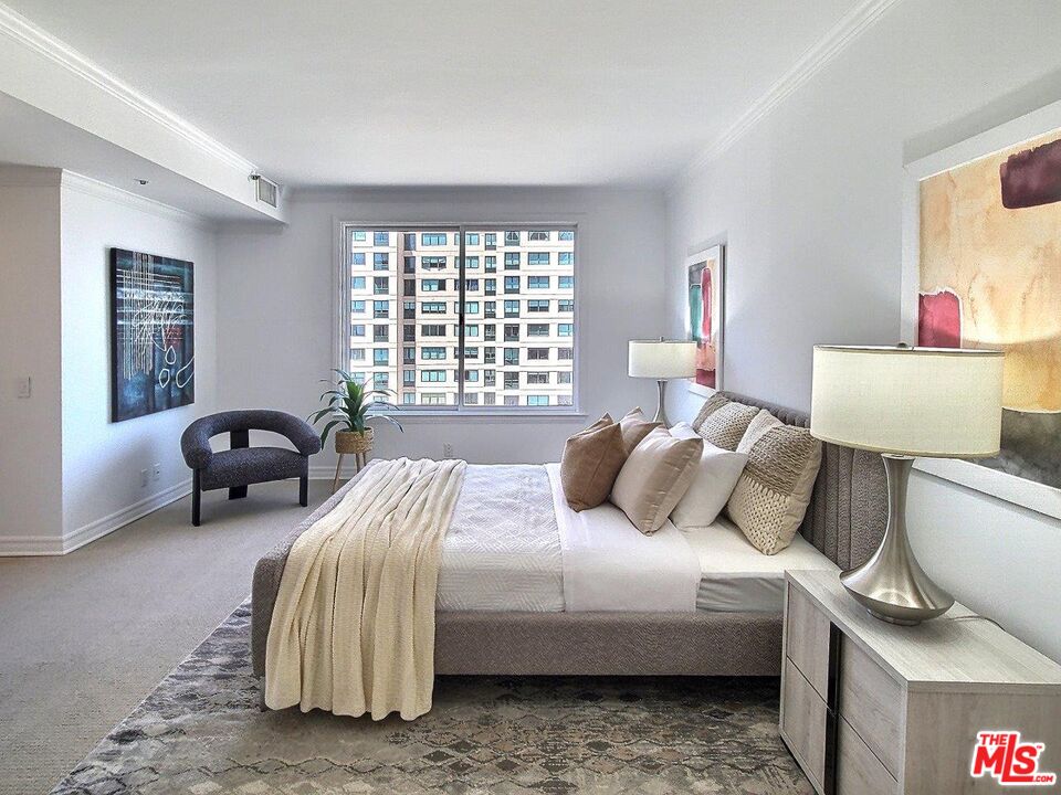 10550 Wilshire Boulevard, Unit 1004 Los Angeles, CA 90024 - Photo 28 of 39 a bedroom with a bed and a large window