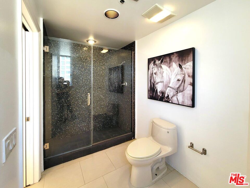 10550 Wilshire Boulevard, Unit 1004 Los Angeles, CA 90024 - Photo 32 of 39 a bathroom with a toilet sink and shower