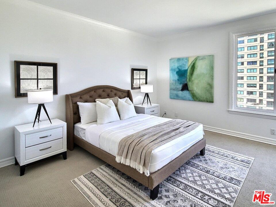 10550 Wilshire Boulevard, Unit 1004 Los Angeles, CA 90024 - Photo 34 of 39 a bedroom with bed and a window