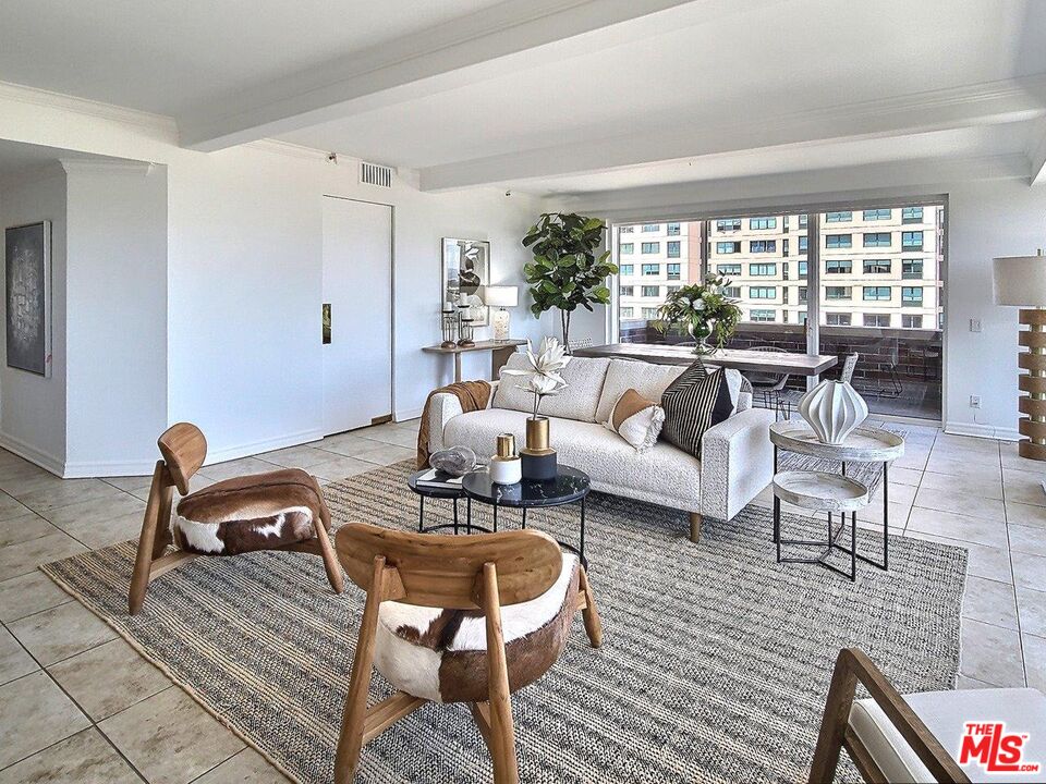10550 Wilshire Boulevard, Unit 1004 Los Angeles, CA 90024 - Photo 6 of 39 a living room with furniture and a large window