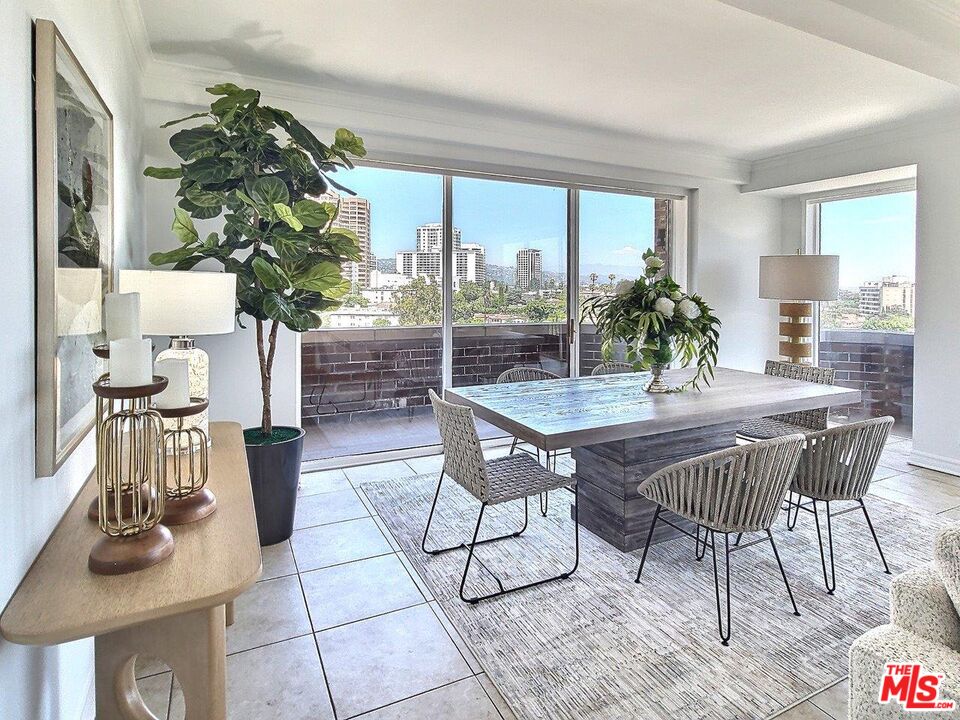 10550 Wilshire Boulevard, Unit 1004 Los Angeles, CA 90024 - Photo 8 of 39 a dining room view with a table and chairs