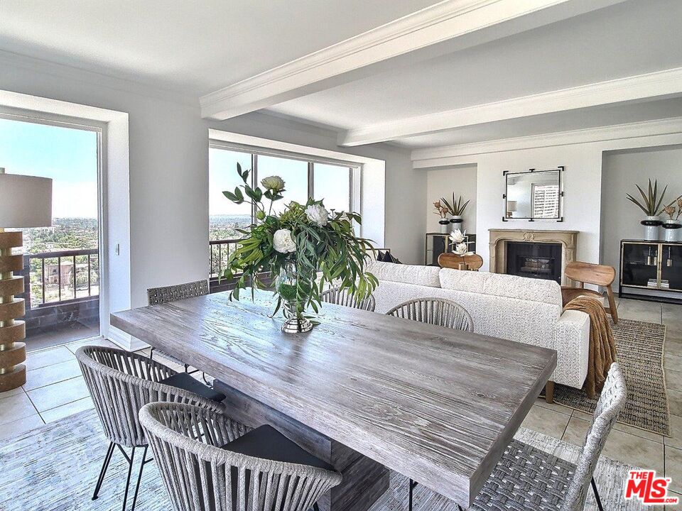 10550 Wilshire Boulevard, Unit 1004 Los Angeles, CA 90024 - Photo 9 of 39 a living room with furniture and a potted plant