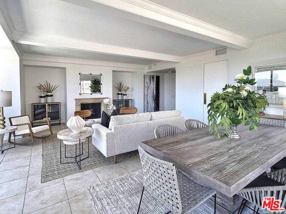 10550 Wilshire Boulevard, Unit 1004 Los Angeles, CA 90024 - Photo 10 of 39 a living room with furniture and a fireplace