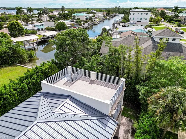 a kitchen with a sink stove and microwave