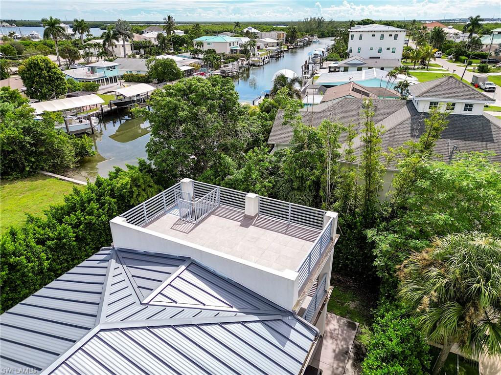 145 Capri Boulevard Naples, FL 34113 - Photo 15 of 33 an aerial view of a house with a yard