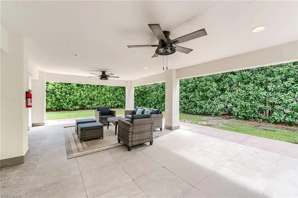 a view of a patio with a backyard