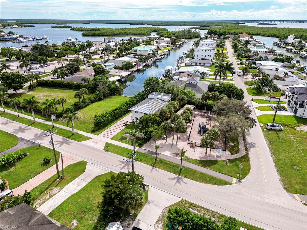 145 Capri Boulevard Naples, FL 34113 - Photo 31 of 33 an aerial view of a house with a garden