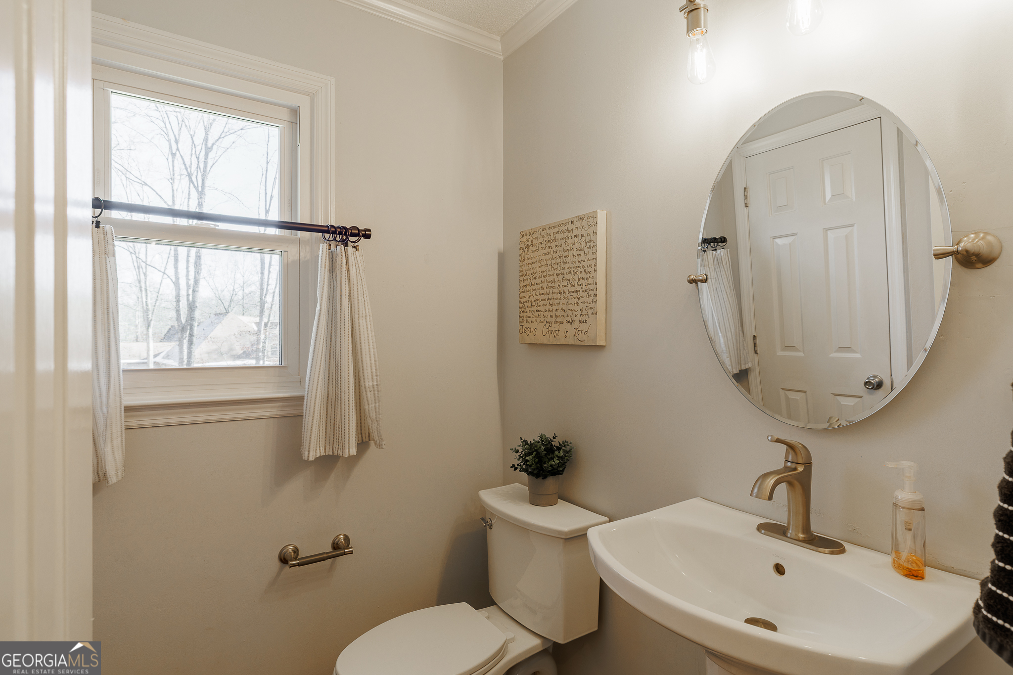 415 Brookstone Drive Athens, GA 30605 - Photo 12 of 55 a bathroom with a toilet sink and mirror