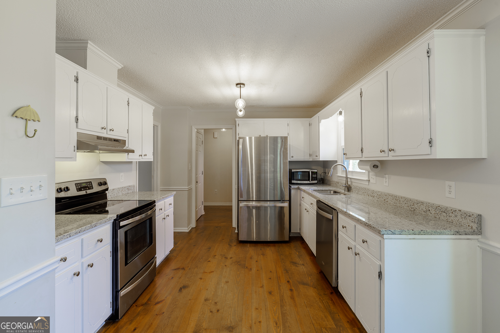 415 Brookstone Drive Athens, GA 30605 - Photo 17 of 55 a kitchen with granite countertop a sink a counter top space stainless steel appliances and cabinets