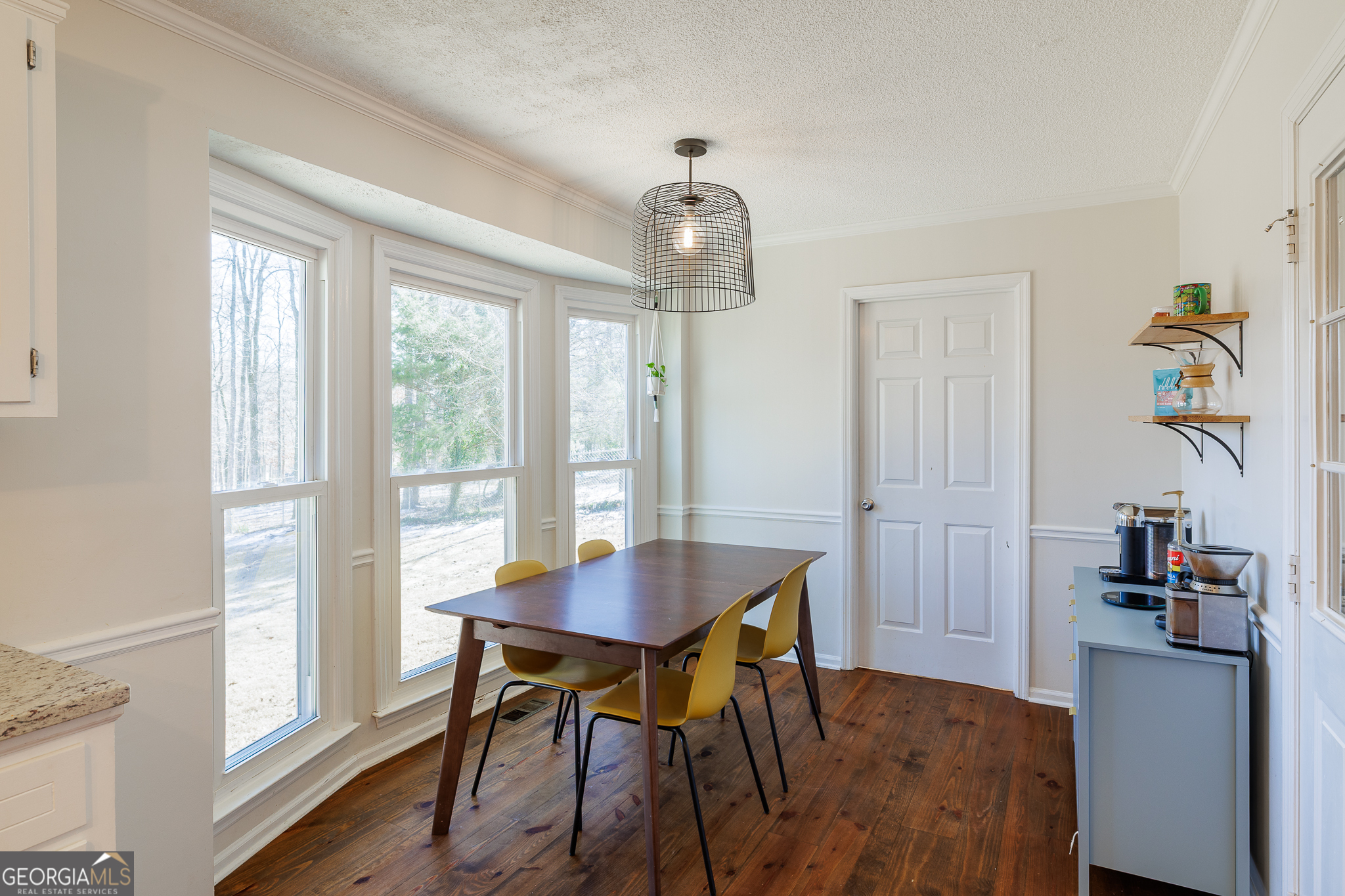 415 Brookstone Drive Athens, GA 30605 - Photo 19 of 55 a view of a dining room with furniture window and wooden floor
