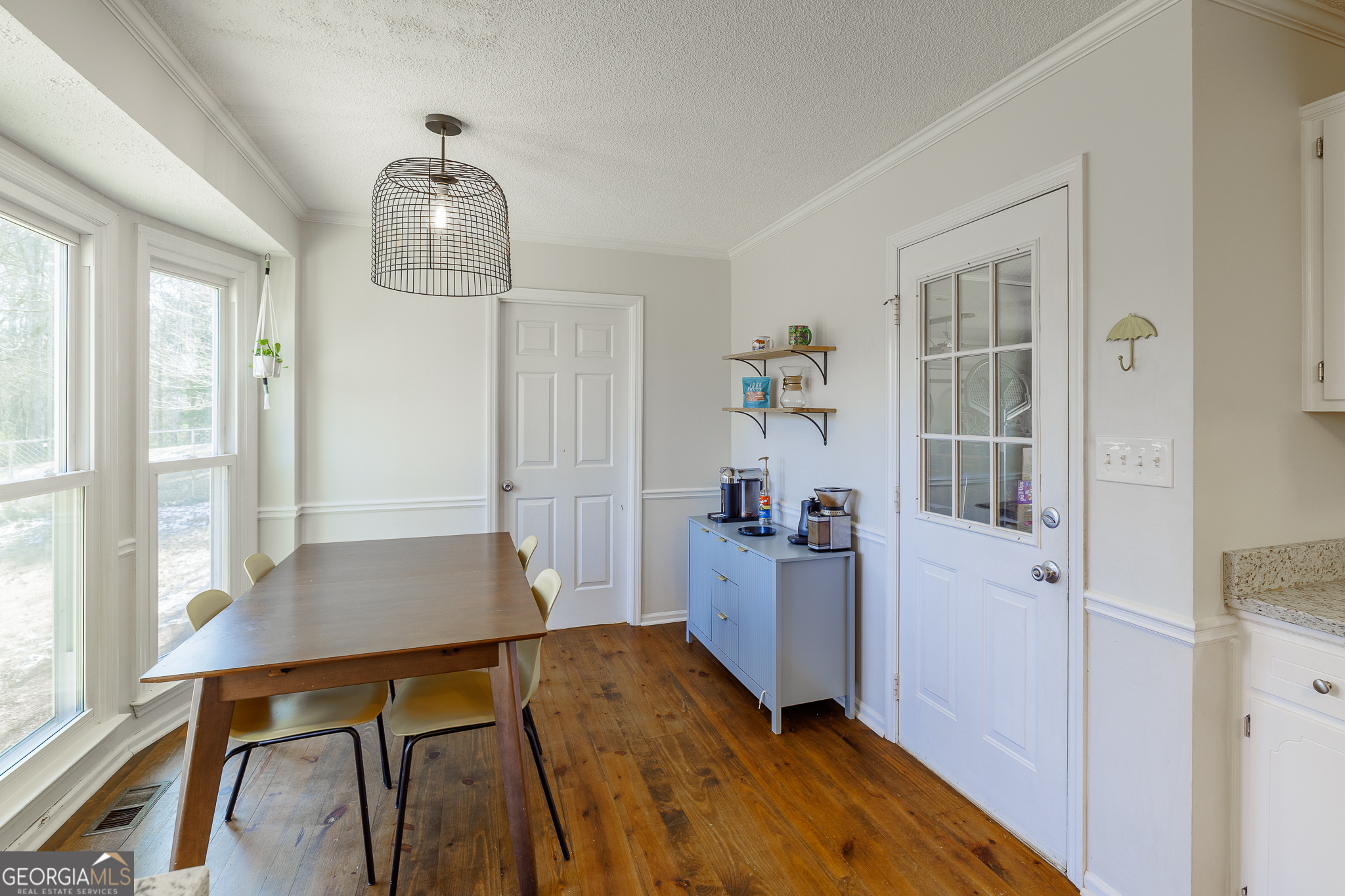415 Brookstone Drive Athens, GA 30605 - Photo 22 of 55 a room with a table and chairs