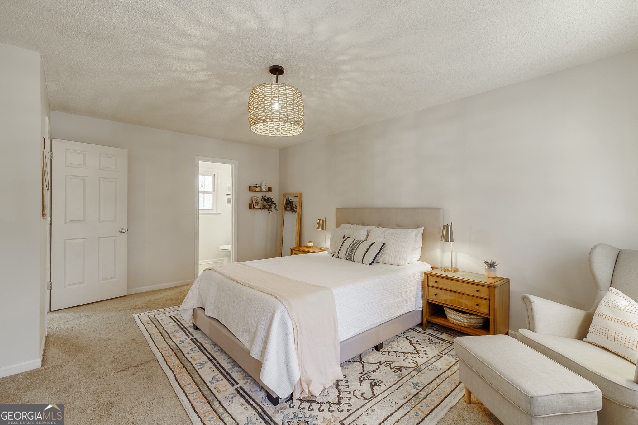 415 Brookstone Drive Athens, GA 30605 - Photo 30 of 55 a bedroom with a bed and a chandelier