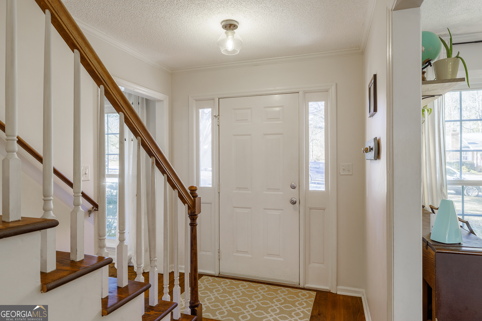415 Brookstone Drive Athens, GA 30605 - Photo 4 of 55 a view of an entryway with wooden floor and stairs