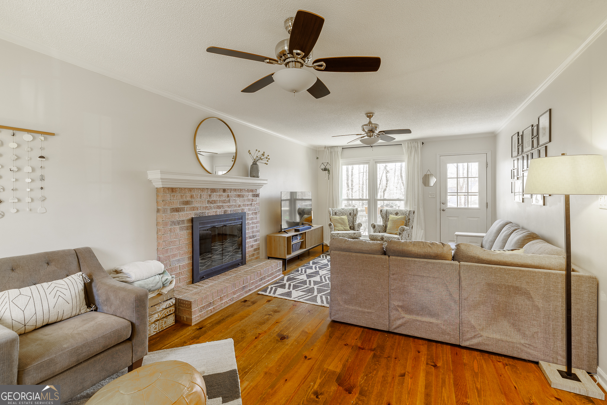 415 Brookstone Drive Athens, GA 30605 - Photo 7 of 55 a living room with furniture and a fireplace