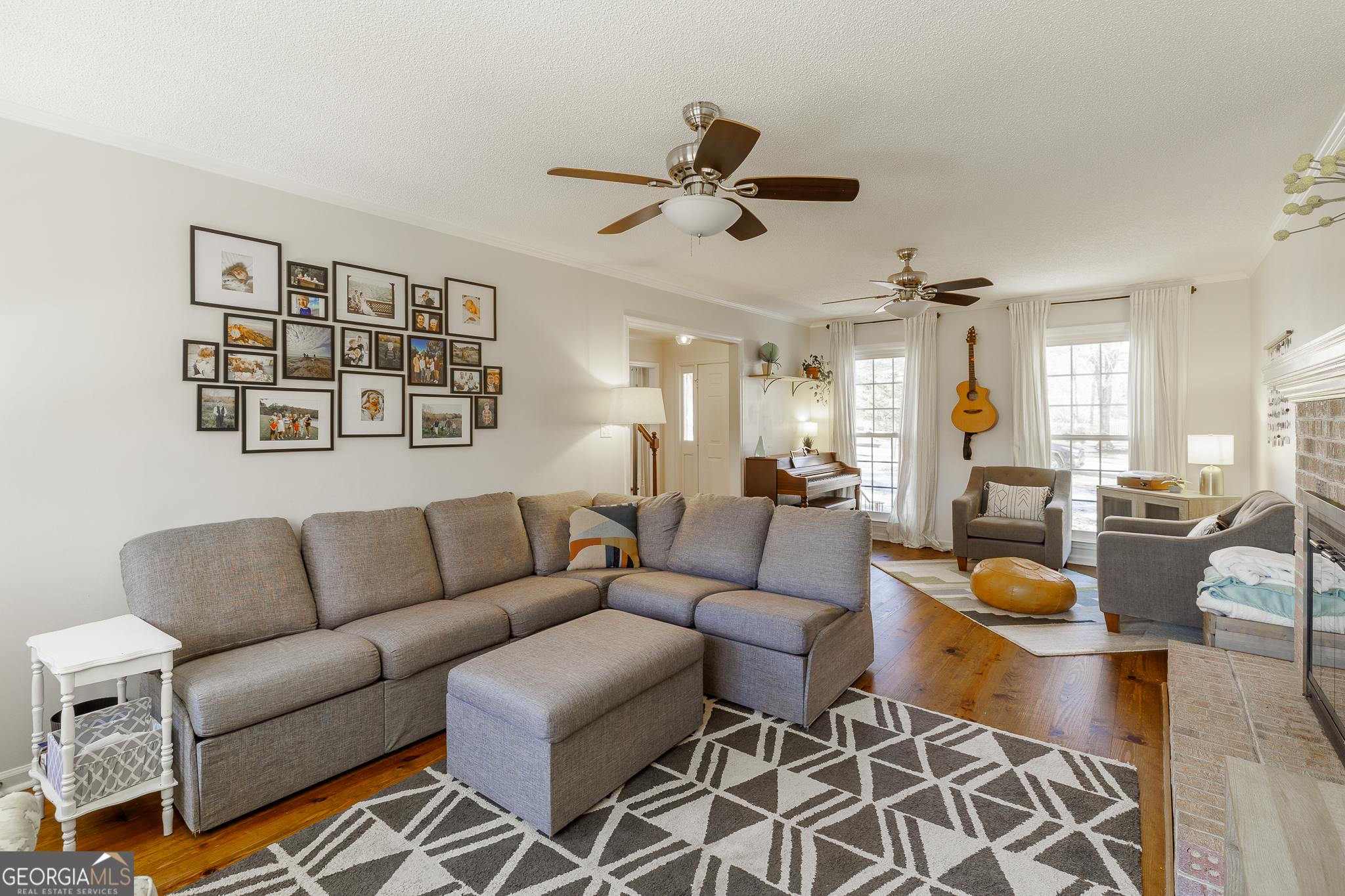 415 Brookstone Drive Athens, GA 30605 - Photo 9 of 55 a living room with furniture a rug and a large window