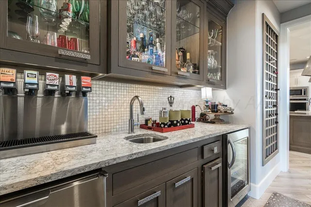 a kitchen with sink and cabinets