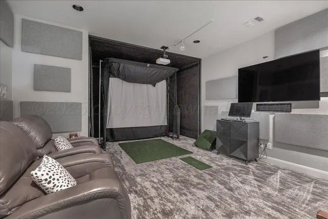 a bedroom with a bed and flat screen tv
