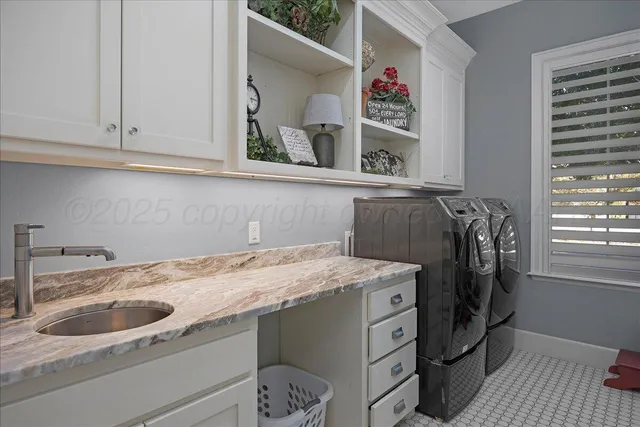 a storage room with washer and dryer