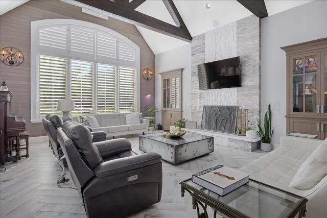 a living room with furniture fireplace and a flat screen tv