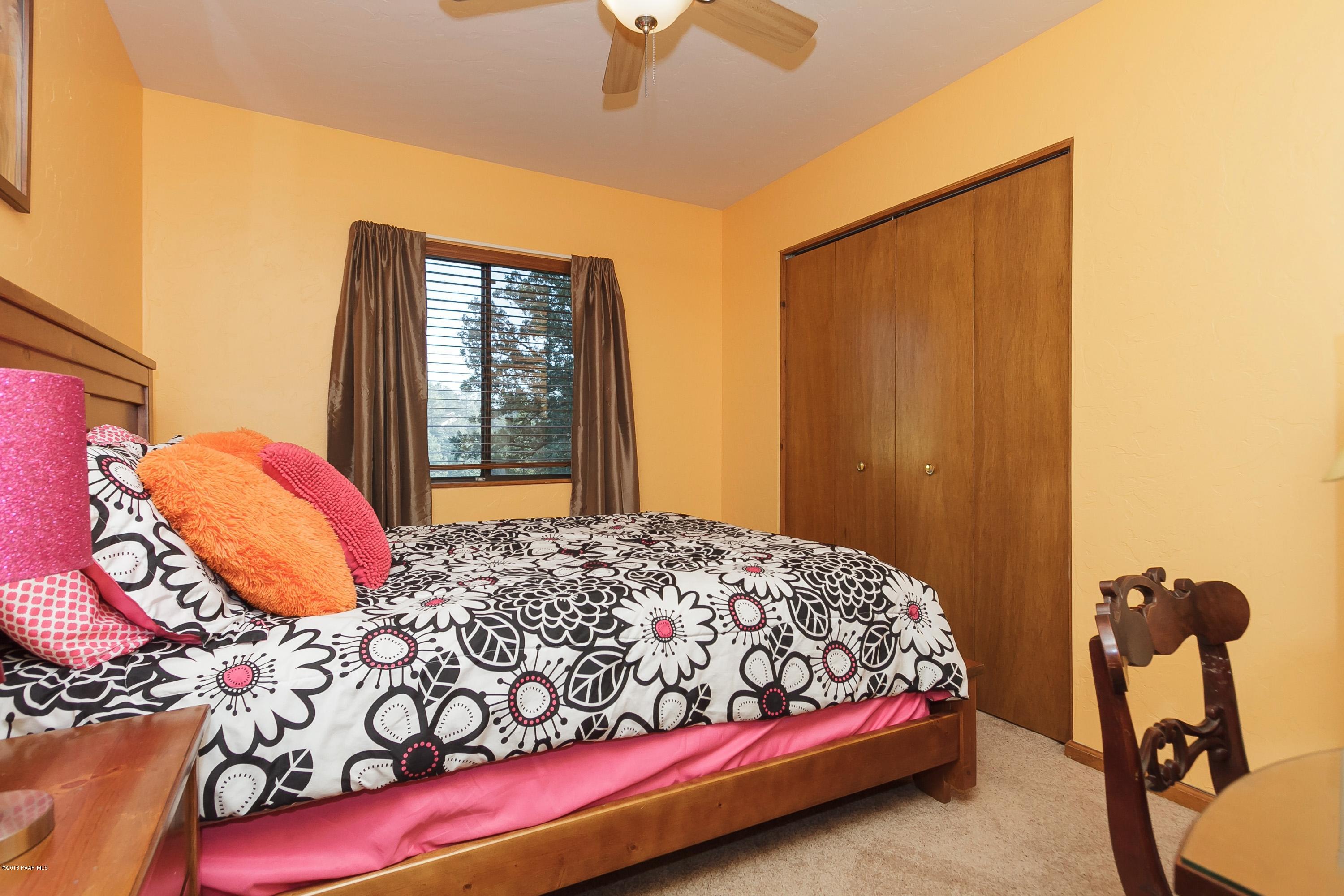 914 Forest Hylands Road Prescott, AZ 86303 - Photo 12 of 22 a bedroom with a bed and a window