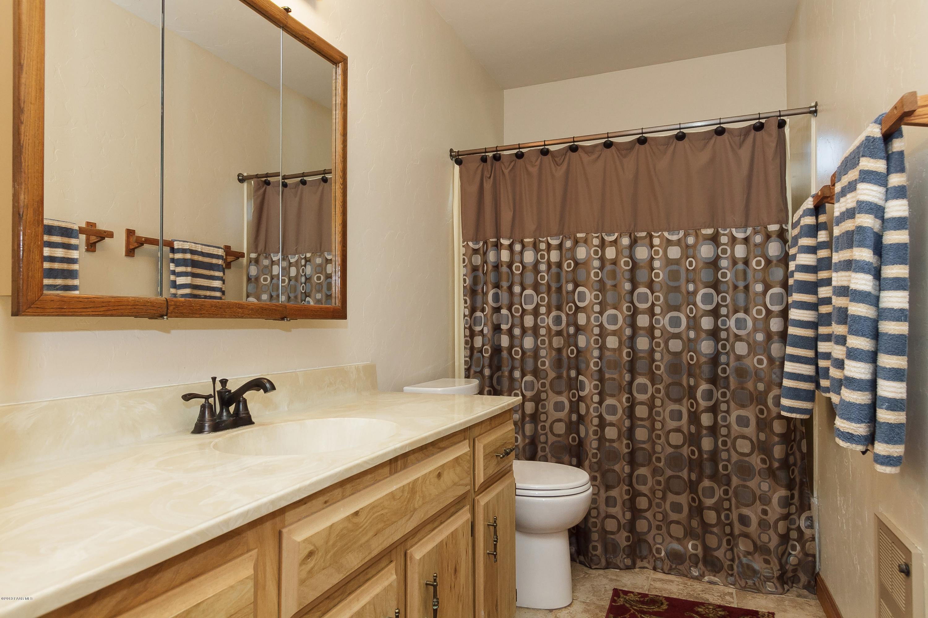 914 Forest Hylands Road Prescott, AZ 86303 - Photo 13 of 22 a bathroom with a sink toilet and shower