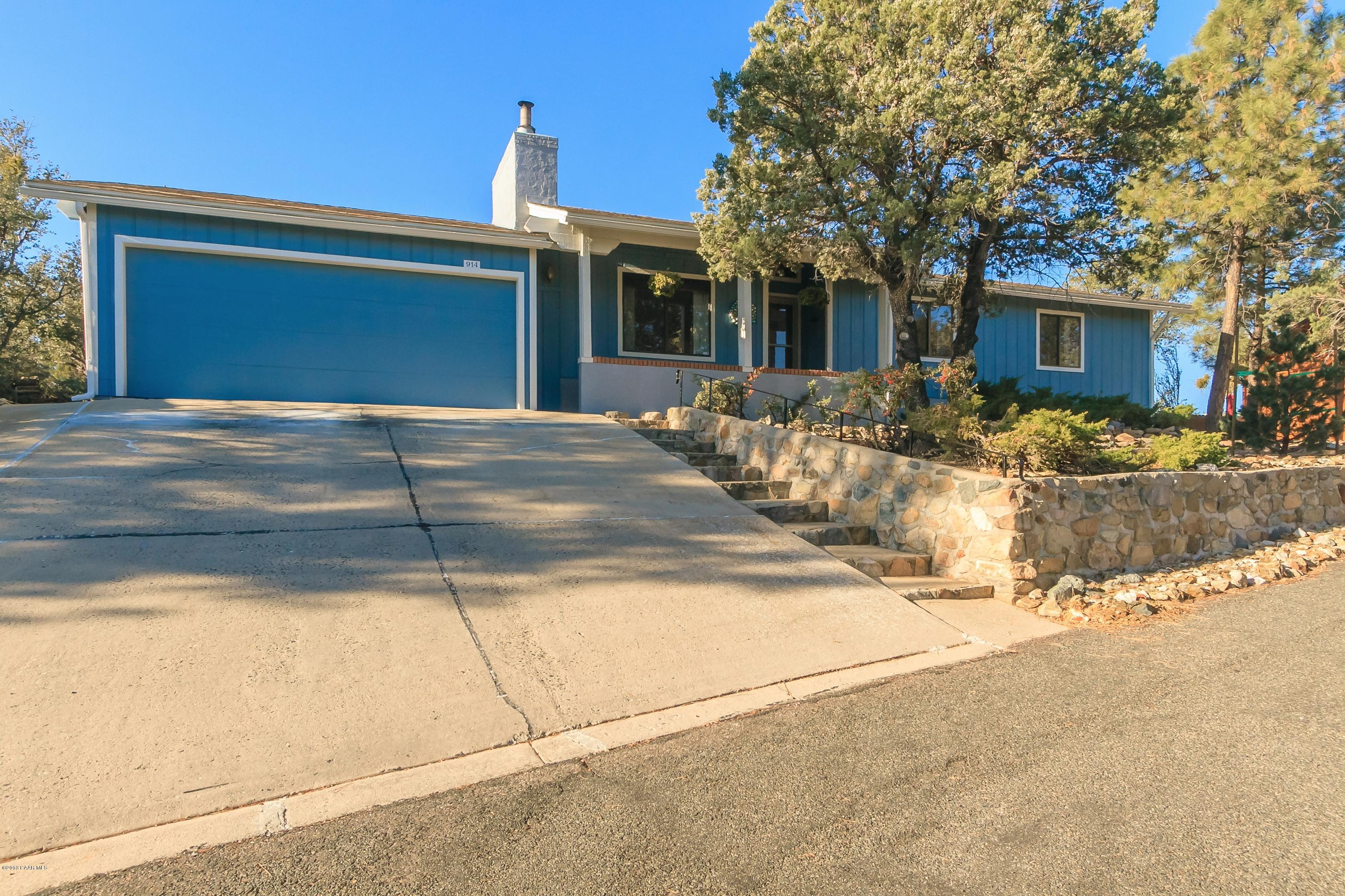 914 Forest Hylands Road Prescott, AZ 86303 - Photo 2 of 22 a front view of a house with a garage