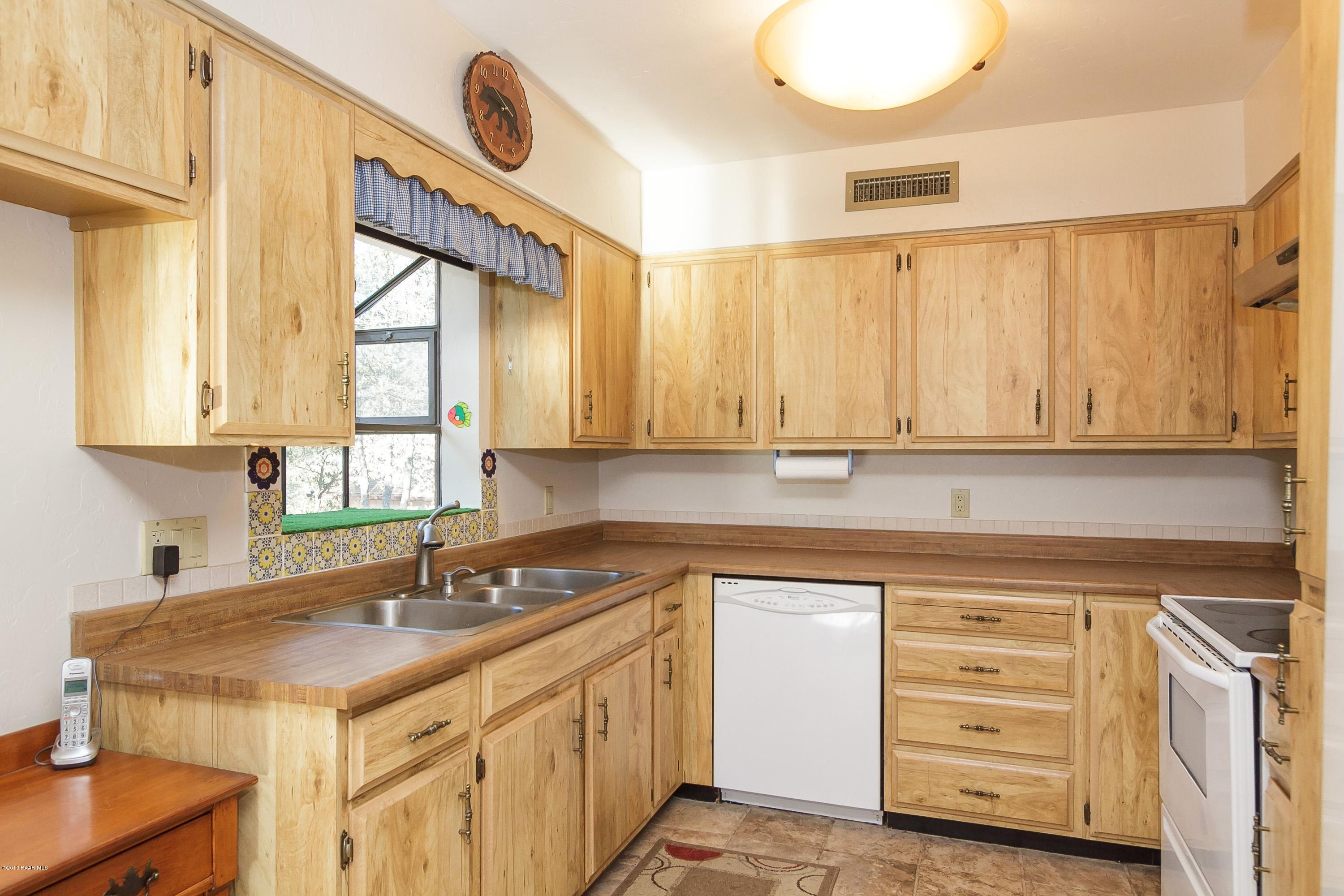 914 Forest Hylands Road Prescott, AZ 86303 - Photo 7 of 22 a kitchen with a sink cabinets and window