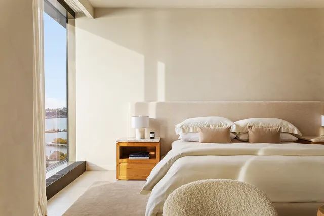 a bedroom with bed and a couch