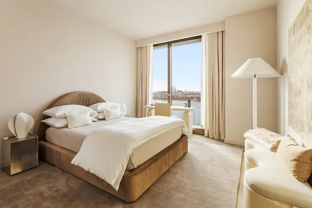 a bathroom with a sink double vanity granite tub shower and a mirror