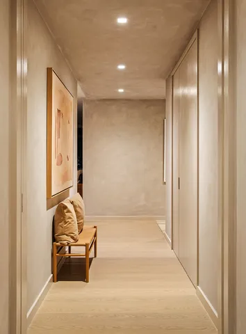 a living room with furniture and floor to ceiling window