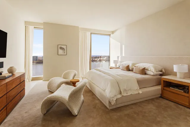 a view of a hallway with couch and furniture