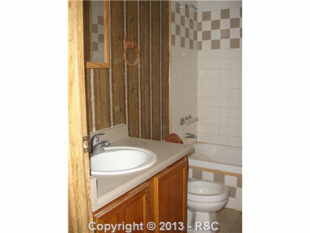 3315 Wiesner Road Calhan, CO 80808 - Photo 7 of 23 Note the new tile and that bathroom has been improved.