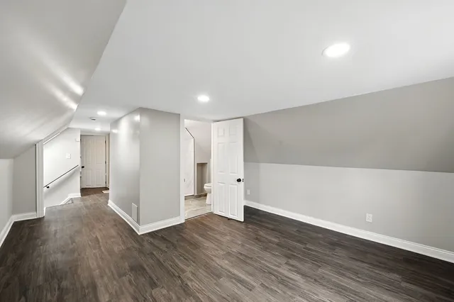 a view of hallway with wooden floor