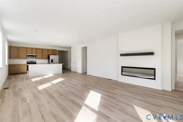 a view of kitchen and wooden floor