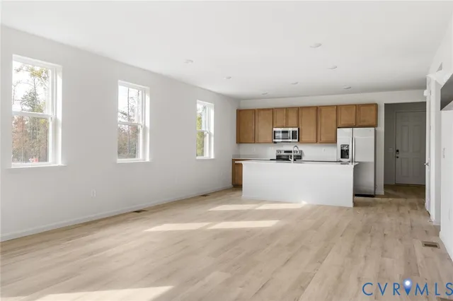 a view of a kitchen with microwave and cabinets