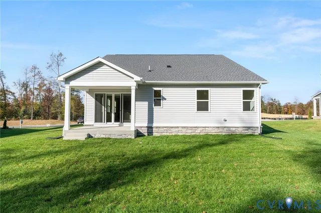a front view of a house with a yard and porch