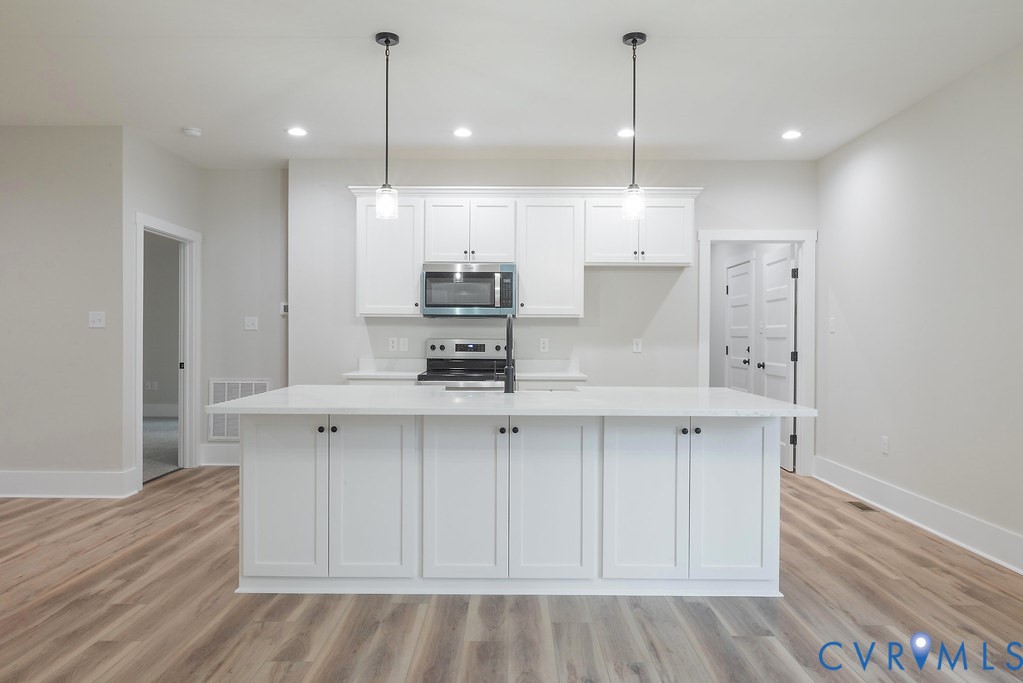 1 Tabscott Road Kents Store, VA 23084 - Photo 17 of 42 Kitchen island featuring a white countertop, penda