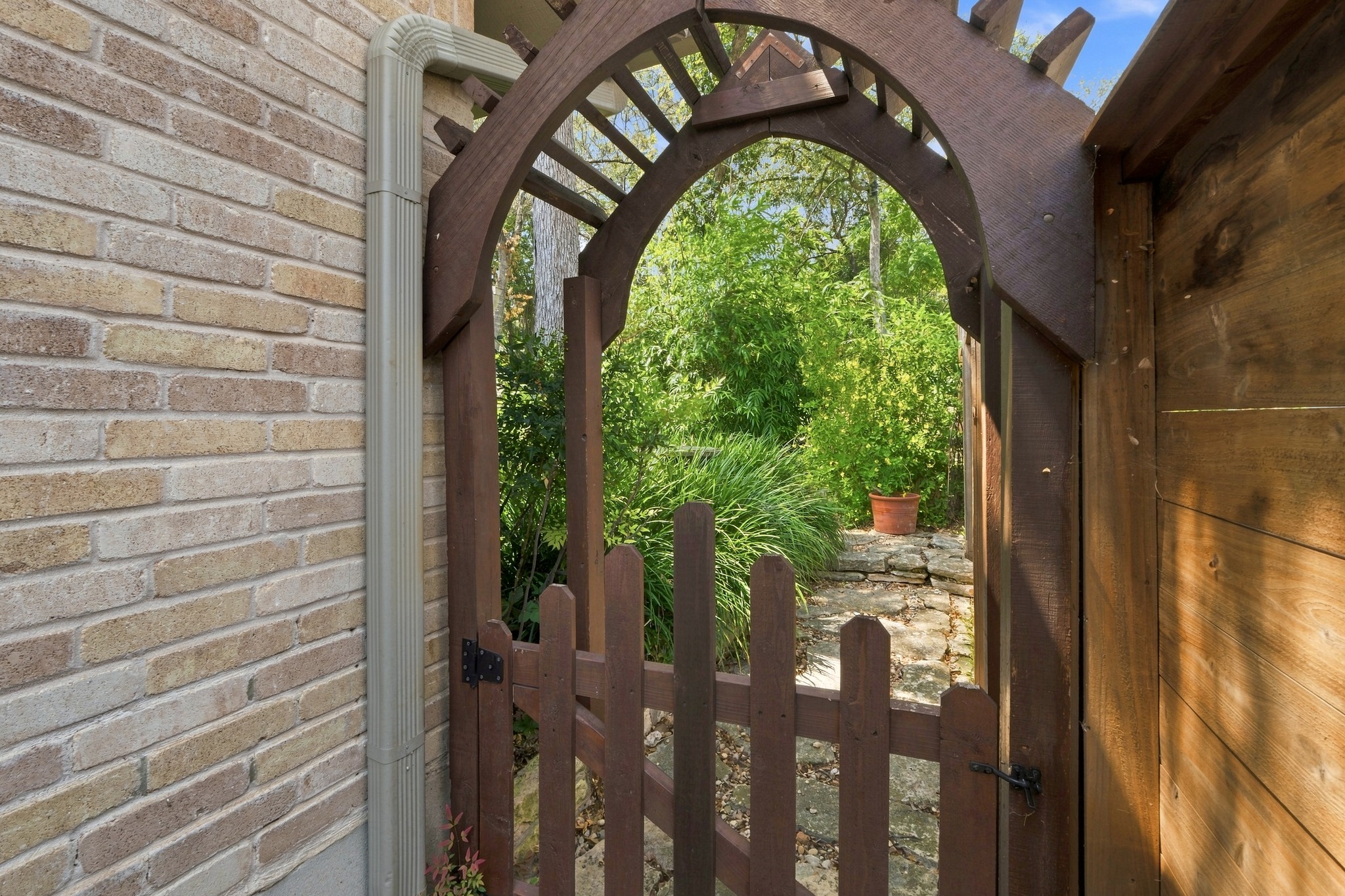 1904 Stoneridge Road Austin, TX 78746 - Photo 36 of 40 Charming garden gate adds another special detail to this beautifully maintained property.