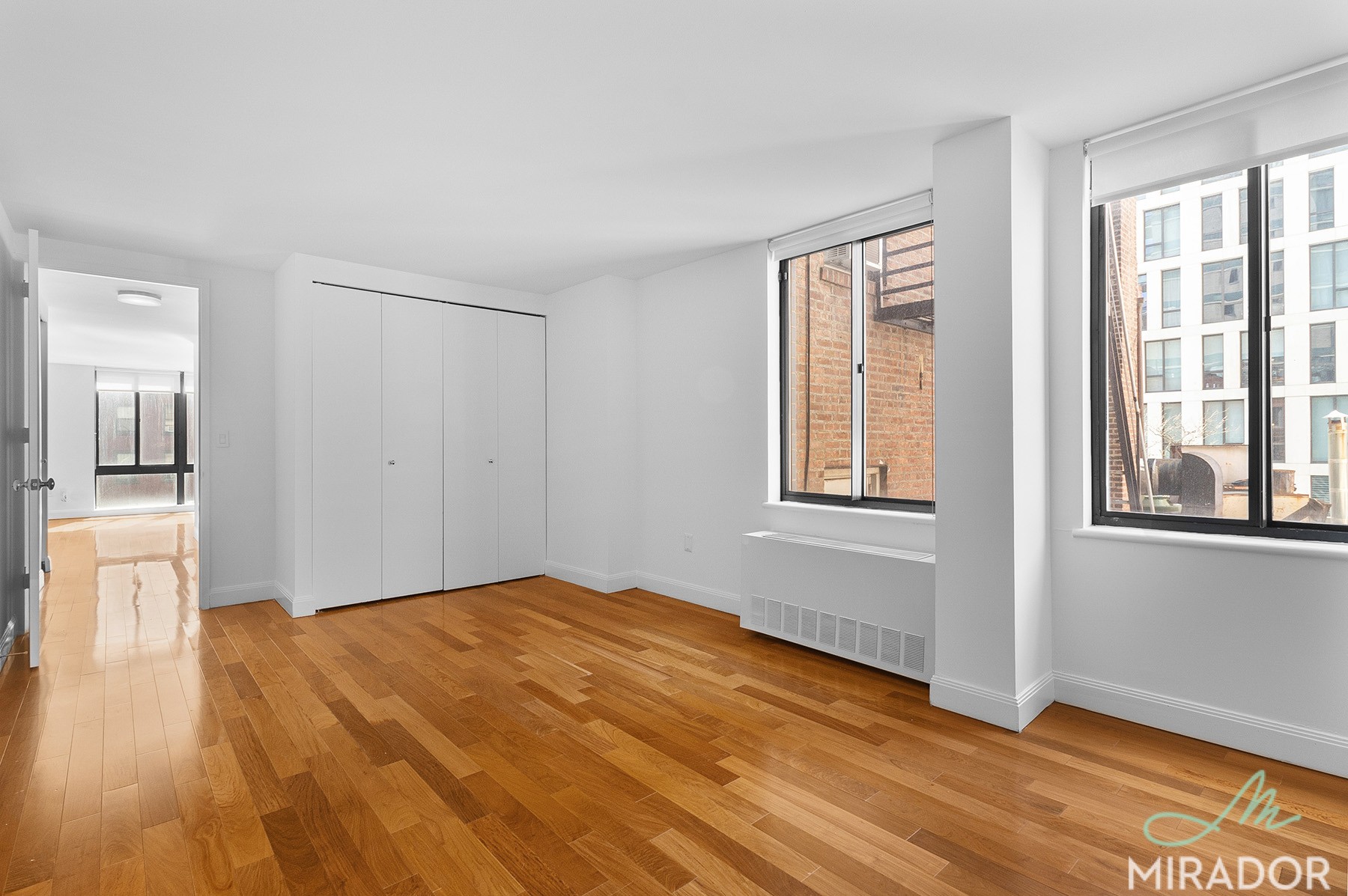 290 3rd Avenue, Unit 4C Manhattan, NY 10010 - Photo 13 of 27 a bedroom with a bed and wooden floor