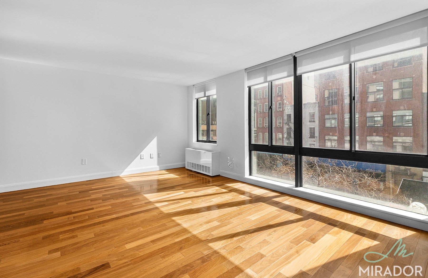 290 3rd Avenue, Unit 4C Manhattan, NY 10010 - Photo 4 of 27 a view of an empty room and window