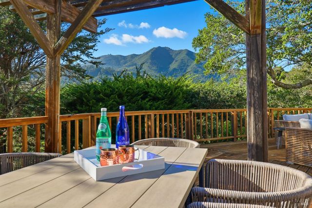 a view of a two chairs in the deck
