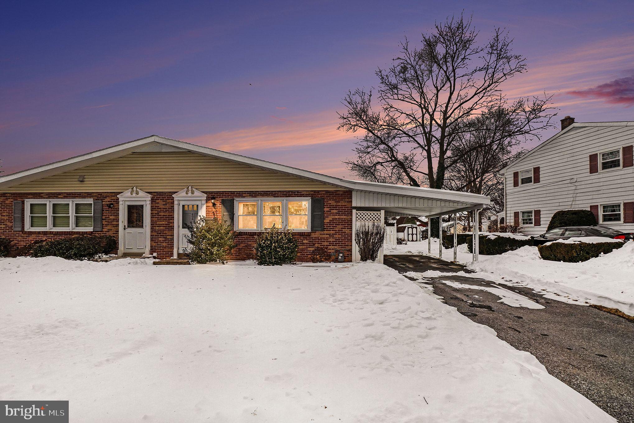 504 Hensley Street Lititz, PA 17543 - Photo 1 of 34 a front view of a house with yard covered in snow
