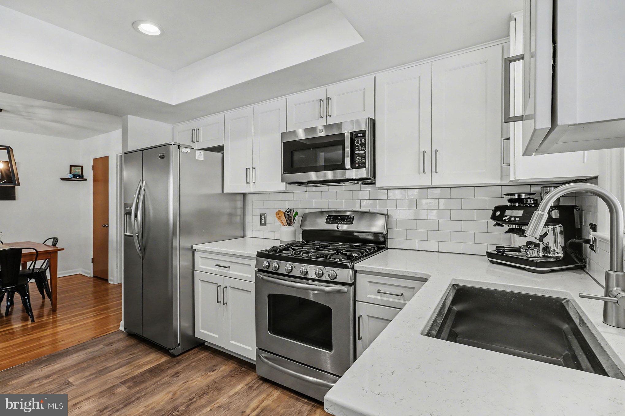 504 Hensley Street Lititz, PA 17543 - Photo 14 of 34 a kitchen with a stove a microwave and refrigerator