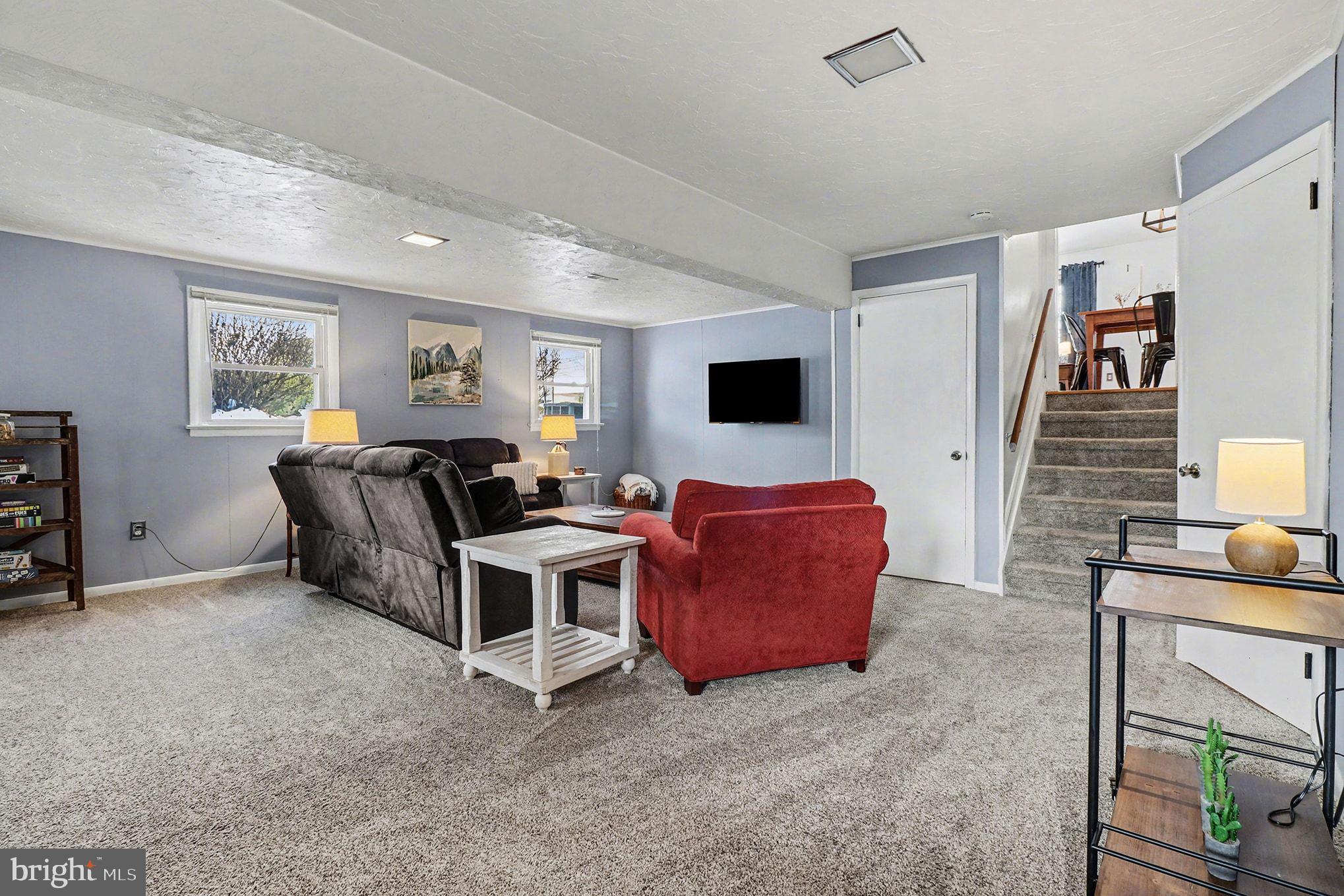 504 Hensley Street Lititz, PA 17543 - Photo 16 of 34 a living room with furniture a couch and a flat screen tv