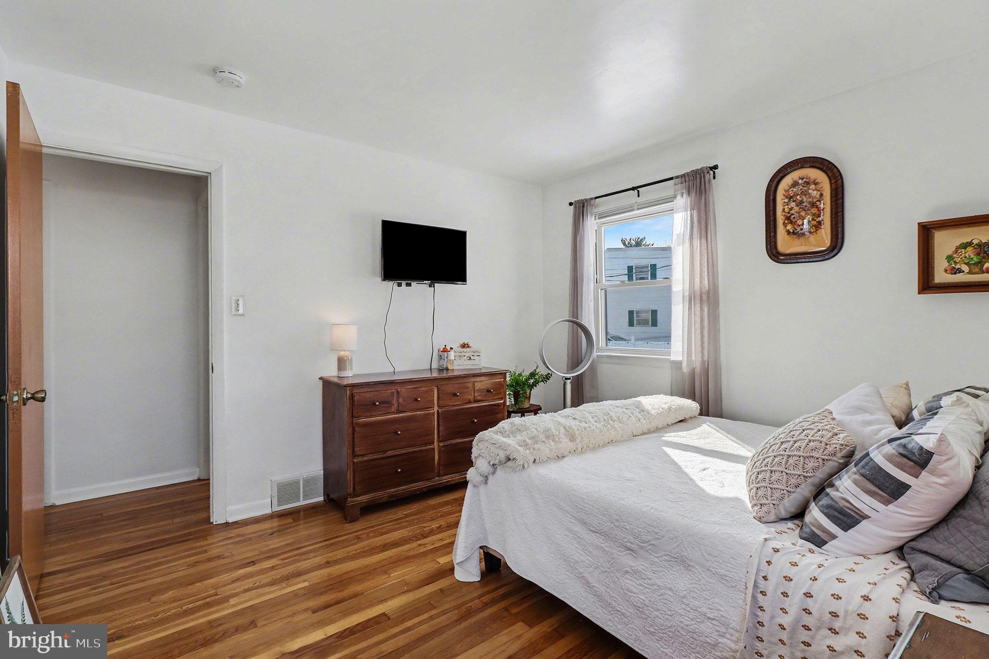 504 Hensley Street Lititz, PA 17543 - Photo 20 of 34 a bedroom with a bed and a flat screen tv